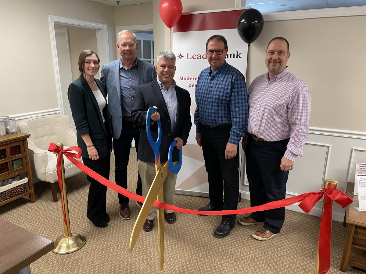 Leader Bank Team Members cut the ribbon at the new Holden Residential Lending Office.