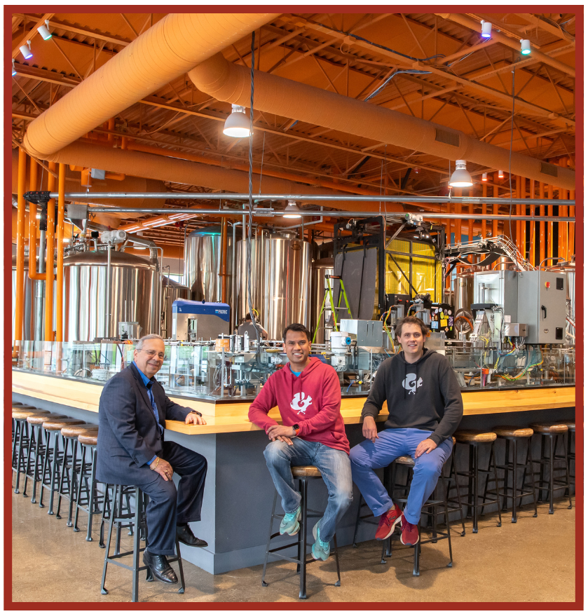 Leader Bankâs John Sergi with Mighty Squirrel Co-Founders Naveen Pawar and Henry Manice at the Waltham brewery.