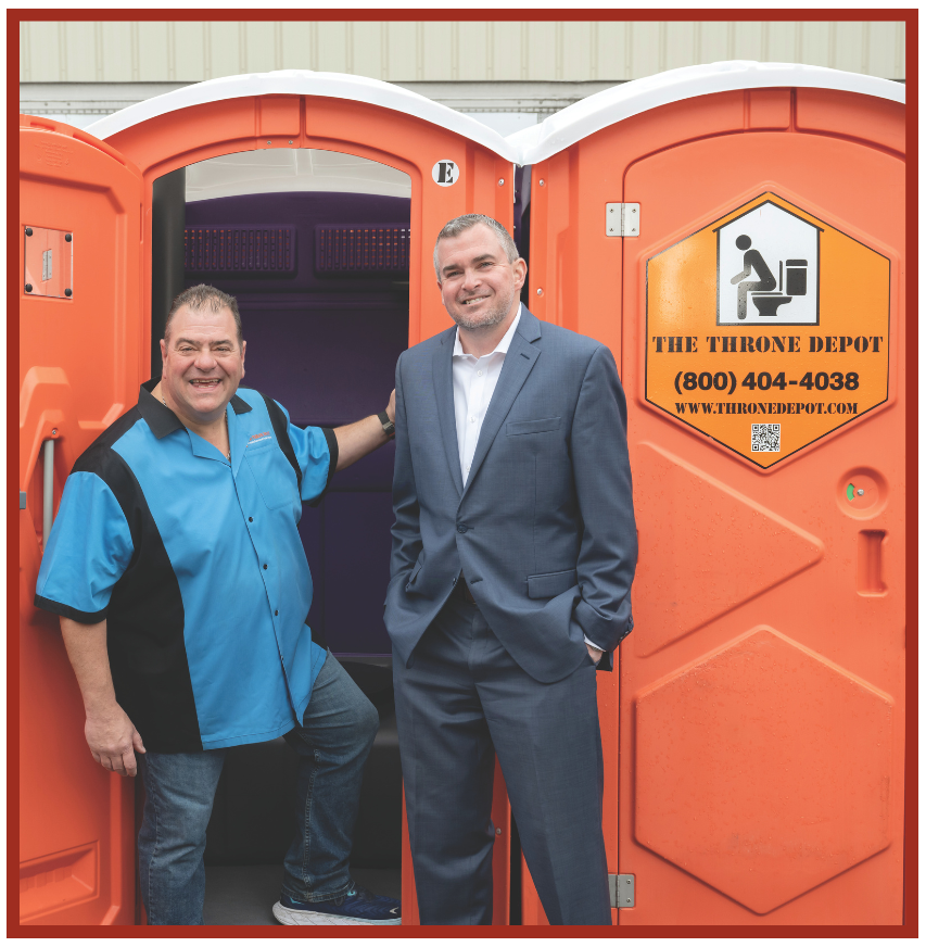 The Throne Depot co-owner Steve Brodeur (left) and Leader Bank Vice President and Commercial Loan Officer Kevin McSweeney at the businessâs portable restroom and trailer headquarters.