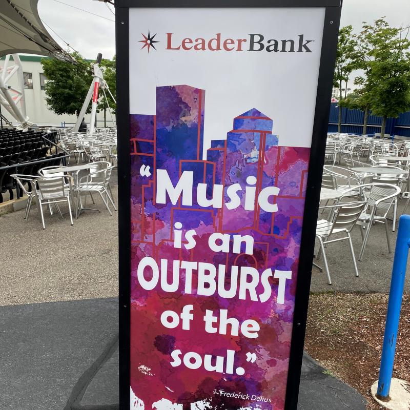 Leader Bank Pavilion sign stating, “Music is an OUTBURST of the soul.” - Frederick Delius